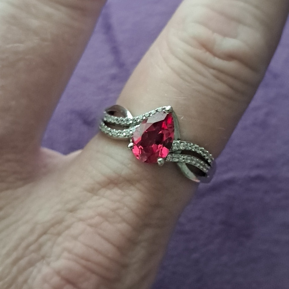 Padparadscha Sapphire & White Zircon Accented Triple Shank Ring.